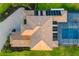 Aerial view of the home, pool, and deck showcasing the layout and landscaping at 4712 Margutta Ct, Sarasota, FL 34240