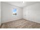 Cozy bedroom with plush carpet, a window with a neighborhood view, and a double door closet at 4712 Margutta Ct, Sarasota, FL 34240