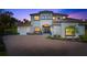 Stately two-story home boasts a grand entrance, lush landscaping, and a brick driveway at 4712 Margutta Ct, Sarasota, FL 34240