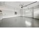Spacious three car garage with epoxy floors, high ceilings, and natural light at 4712 Margutta Ct, Sarasota, FL 34240