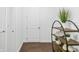 Hallway with beautiful dark wood floors, neutral walls, white trim and a decorative shelf at 4712 Margutta Ct, Sarasota, FL 34240