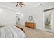 Spacious bedroom offers natural light, ceiling fan, and access to the lanai at 4712 Margutta Ct, Sarasota, FL 34240