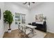 Modern office with dual workstations, stylish decor, bright natural light, and a view of the backyard pool at 4712 Margutta Ct, Sarasota, FL 34240