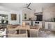 Outdoor kitchen area featuring a built-in grill, stone accents, ceiling fan, and a dining table at 4712 Margutta Ct, Sarasota, FL 34240