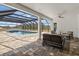 Inviting screened-in pool and patio area with comfortable seating, perfect for relaxation and entertaining at 4712 Margutta Ct, Sarasota, FL 34240