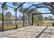 Large screened-in patio with scenic views, offering a great outdoor living space at 4712 Margutta Ct, Sarasota, FL 34240