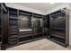 Large walk-in closet with custom built-in shelving and organization system at 4712 Margutta Ct, Sarasota, FL 34240