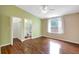 Well-lit bedroom with wood floors, an en-suite bathroom and a large window with pleasant views at 4790 70Th N St, St Petersburg, FL 33709