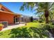 Expansive backyard with a lush lawn, mature trees, and a screened patio, creating a perfect space for outdoor enjoyment at 4926 Sabal Lake Cir, Sarasota, FL 34238