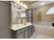 A primary bathroom featuring double sinks, a soaking tub, and a separate shower at 4926 Sabal Lake Cir, Sarasota, FL 34238