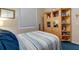This is a view of a bedroom space featuring wood cabinets and blue carpet at 4926 Sabal Lake Cir, Sarasota, FL 34238