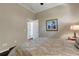 This is a view of a bedroom space with art hanging on the walls and a doorway to the next room at 4926 Sabal Lake Cir, Sarasota, FL 34238
