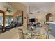 Bright dining area overlooking the lanai and living room at 4926 Sabal Lake Cir, Sarasota, FL 34238