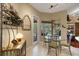 Bright dining area with views of the lanai and a wine rack, perfect for entertaining guests at 4926 Sabal Lake Cir, Sarasota, FL 34238