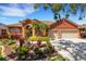 Eye-catching terracotta home has a two-car garage and meticulously maintained landscaping at 4926 Sabal Lake Cir, Sarasota, FL 34238