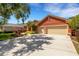 Well-maintained home with a terracotta exterior, two-car garage and an expansive driveway at 4926 Sabal Lake Cir, Sarasota, FL 34238