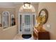 Bright foyer with an arched window above the door and tile flooring at 4926 Sabal Lake Cir, Sarasota, FL 34238