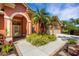 Beautiful home with a covered front entrance, two-car garage and meticulously kept landscaping at 4926 Sabal Lake Cir, Sarasota, FL 34238
