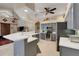 This kitchen features updated stainless steel appliances, a counter bar, and lots of natural light at 4926 Sabal Lake Cir, Sarasota, FL 34238