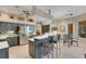 The modern kitchen features updated stainless steel appliances, counter seating, and a view into the breakfast nook at 4926 Sabal Lake Cir, Sarasota, FL 34238