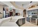 Spacious kitchen with stainless steel appliances, stylish backsplash, and open access to the living area at 4926 Sabal Lake Cir, Sarasota, FL 34238