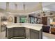 Open kitchen showcasing sink, stainless steel dishwasher, and a view into the bright living area at 4926 Sabal Lake Cir, Sarasota, FL 34238