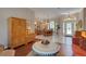 Spacious living area adjacent to dining, featuring hardwood floors and contemporary furnishings at 4926 Sabal Lake Cir, Sarasota, FL 34238