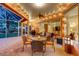 Large covered patio featuring a dining area, lounge seating, and view of outdoor space at 4926 Sabal Lake Cir, Sarasota, FL 34238