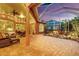 Enclosed lanai features a water feature, lush plants, and comfortable seating at 4926 Sabal Lake Cir, Sarasota, FL 34238