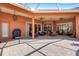 Spacious covered patio with ample seating, ceiling fans, and stylish decor perfect for outdoor entertaining and relaxation at 4926 Sabal Lake Cir, Sarasota, FL 34238