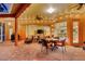 Wide shot of the patio with dining set, seating area, and view of the home's interior at 4926 Sabal Lake Cir, Sarasota, FL 34238