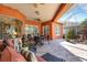 Inviting patio features comfortable seating, ceiling fans, and access to a serene rock garden for outdoor enjoyment at 4926 Sabal Lake Cir, Sarasota, FL 34238