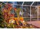 Close-up of rock garden with water feature, tropical plants and turtle sculpture at 4926 Sabal Lake Cir, Sarasota, FL 34238