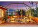 The lanai's rock garden and water feature create a tranquil space for relaxation at 4926 Sabal Lake Cir, Sarasota, FL 34238