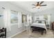 Bright bedroom with cozy bed, natural light, and minimalist décor exudes serene comfort at 516 45Th Street W Ct, Palmetto, FL 34221