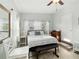 Bright bedroom with a cozy bed and ample natural light from the windows at 516 45Th Street W Ct, Palmetto, FL 34221