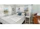 Inviting bedroom bathed in natural light with plush bedding and minimalist decor at 516 45Th Street W Ct, Palmetto, FL 34221