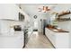 Modern kitchen boasts white cabinetry, a stainless steel fridge, and stylish subway tile backsplash at 516 45Th Street W Ct, Palmetto, FL 34221