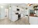Well-lit kitchen with modern appliances, white cabinets, and an open view to the bathroom at 516 45Th Street W Ct, Palmetto, FL 34221