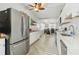 Bright kitchen with stainless steel appliances, white cabinets, and an open view to living areas at 516 45Th Street W Ct, Palmetto, FL 34221