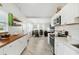 Charming kitchen with an open layout flowing into the dining and living areas at 516 45Th Street W Ct, Palmetto, FL 34221