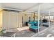 Covered patio with outdoor seating, storage closet, and wooden deck at 516 45Th Street W Ct, Palmetto, FL 34221