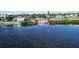 Waterfront view featuring the boat dock and surrounding greenery of a neighborhood at 516 45Th Street W Ct, Palmetto, FL 34221