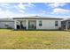 Spacious backyard featuring a covered patio and ample green space at 5317 Patano Loop, Palmetto, FL 34221