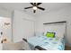 Bright bedroom with a ceiling fan, a large closet and a queen-size bed, creating a comfortable space at 5317 Patano Loop, Palmetto, FL 34221
