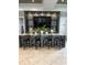 Entertaining area with bar seating, a television and a granite countertop at 5317 Patano Loop, Palmetto, FL 34221