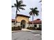 Beautiful community entrance with Spanish-style architecture and lush landscaping at 5317 Patano Loop, Palmetto, FL 34221