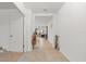 Spacious foyer with tile flooring, high ceilings, and a view into the living area, creating a welcoming entrance at 5317 Patano Loop, Palmetto, FL 34221