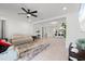 Bright and airy living room with tile flooring, seamlessly connected to other areas of the home at 5317 Patano Loop, Palmetto, FL 34221
