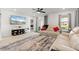Comfortable living room featuring a ceiling fan, access to the patio, and relaxing view from the sofa at 5317 Patano Loop, Palmetto, FL 34221